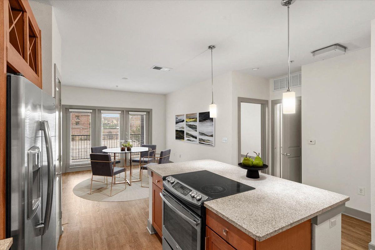 a kitchen and dining area in a 555 waverly unit